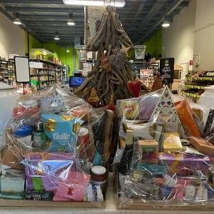 Christmas gift hampers and decorative tree display in store